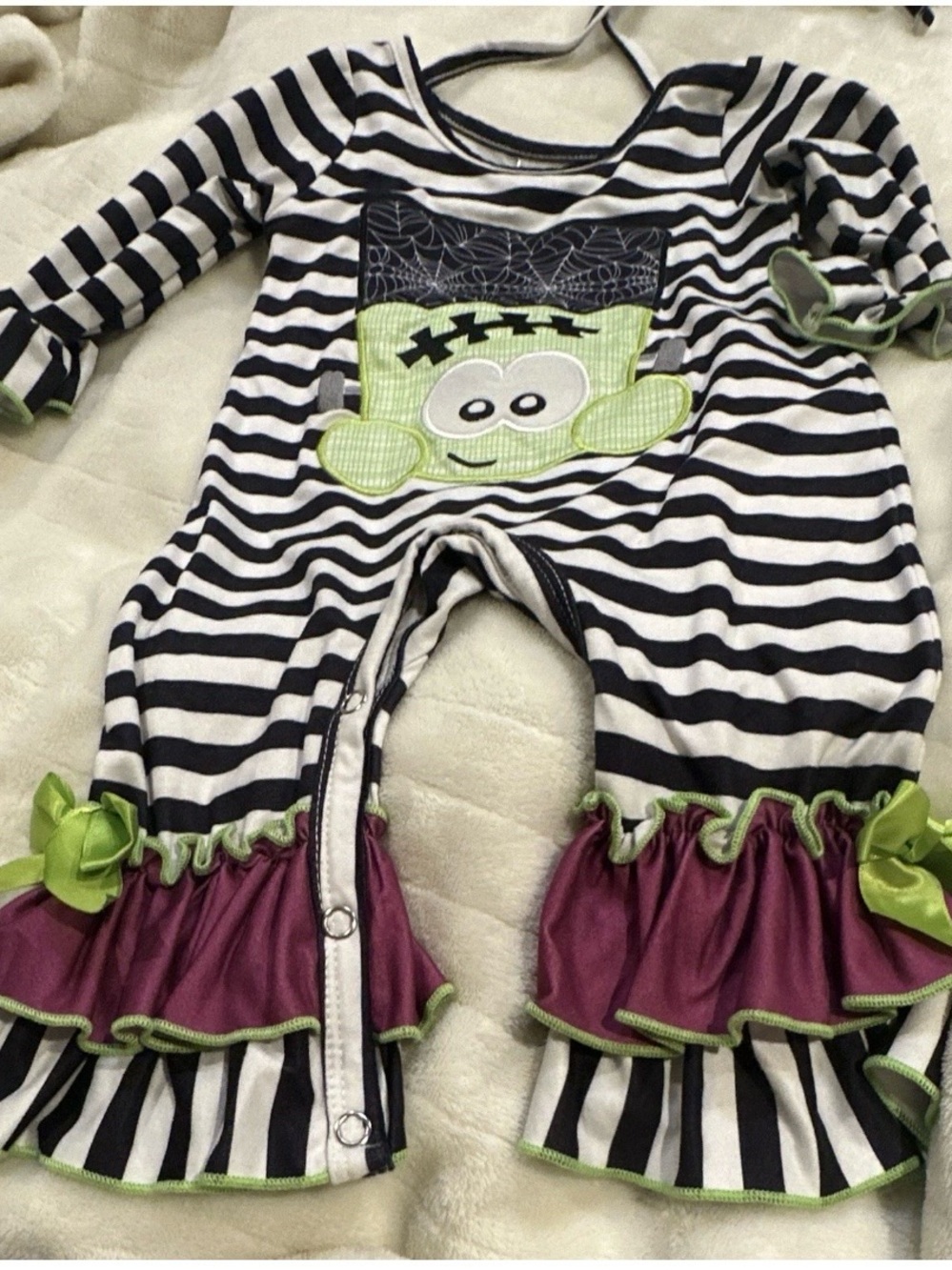 Dash of GlitterStriped Black & White Baby One-Piece with Green Monster Appliqué